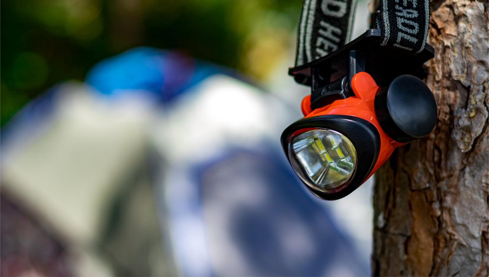 Small,Red,Head,Lamp,For,Camping,Hanging,On,The,Tree